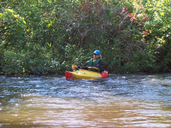 Paddling light rapids on Michigan's Betsie River.