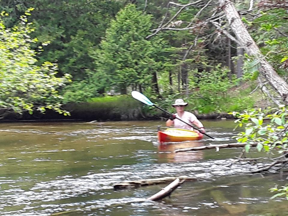 Kayaking through ripples on the Boardman River, near Traverse City, Michigan. 