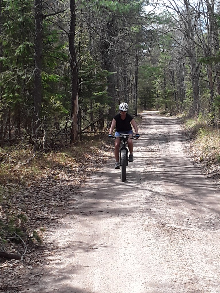 Biking on the Mason Tract Trail, near the South Branch of the Au Sable River.