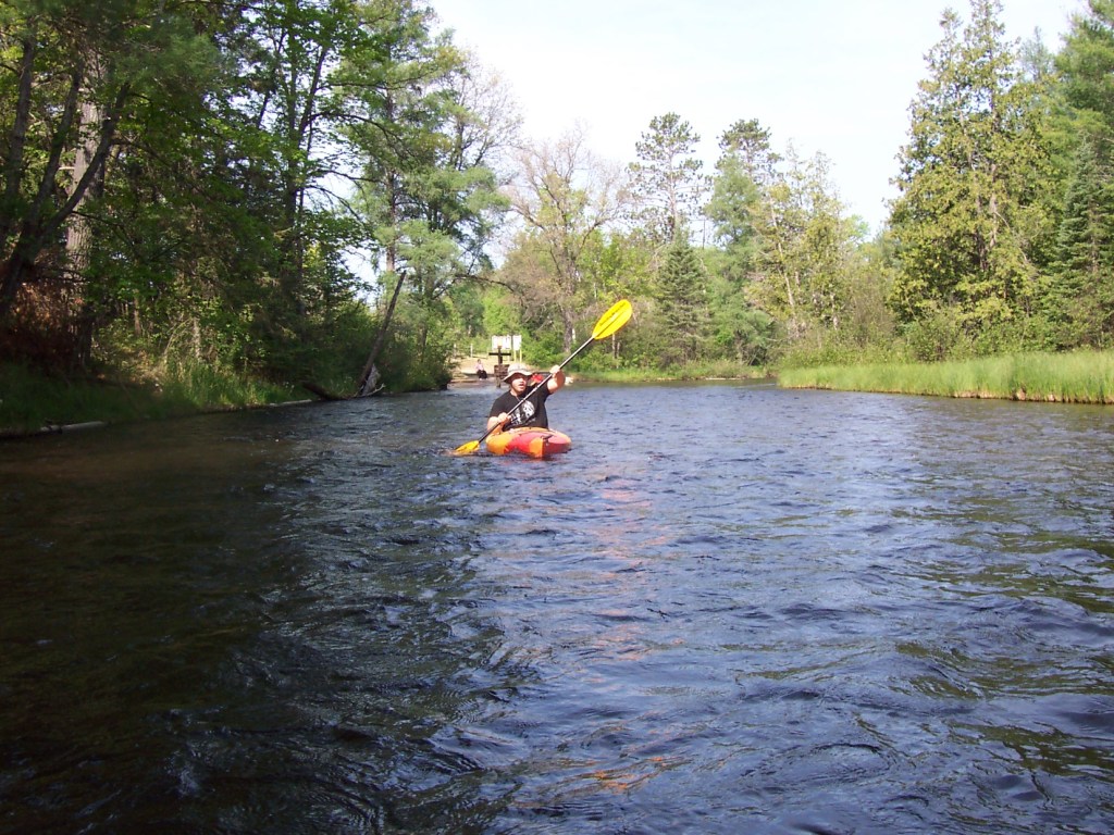 Kayaking past Burton's Landing on the Au Sable River's Holy Waters, near Grayling, Michigan. 